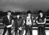 New_line_up_of_the_UK_Subs_posing_it_large_on_London_Bridge2C_1982_28from_L_to_R29_Nicky2C_me2C__Charlie_and_recent_addition2C_Kim_.jpg